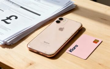 iPhone and Klarna card on table