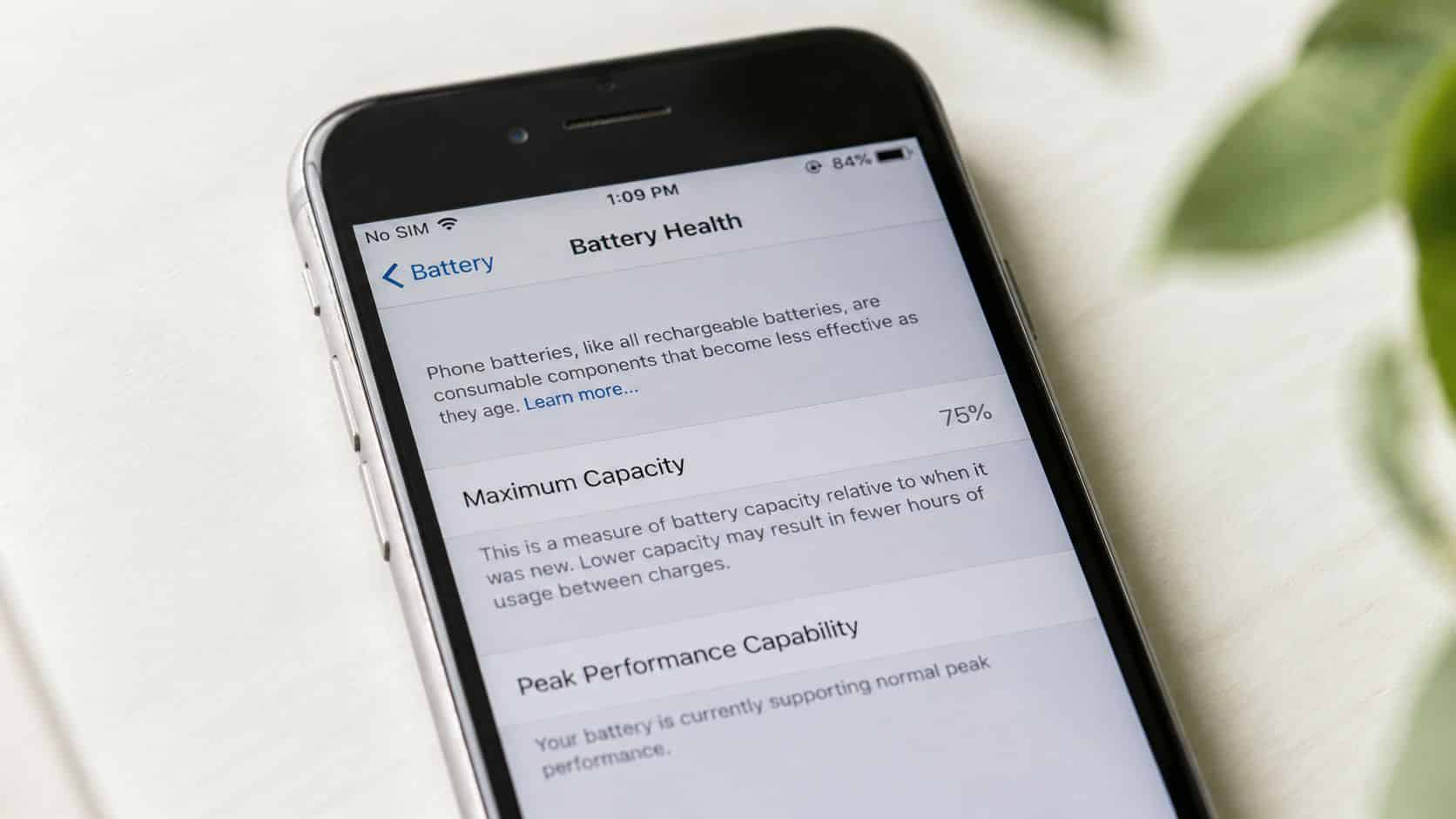 Common Issues with Refurbished iPhones: A UK Buyer's Guide 1 A close-up view of an iPhone screen displaying battery health settings with a seventy-five percent maximum capacity.