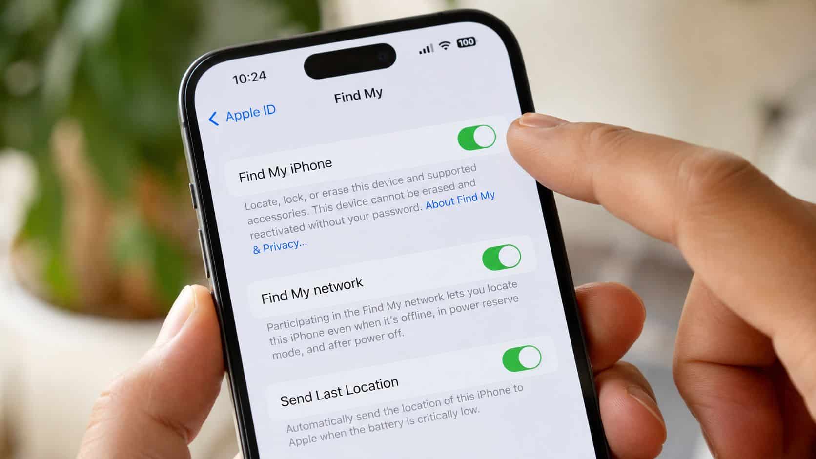 How to Reset a Refurbished iPhone: A Complete Guide 25 A close-up view of a hand holding an iPhone displaying the Find My settings screen.