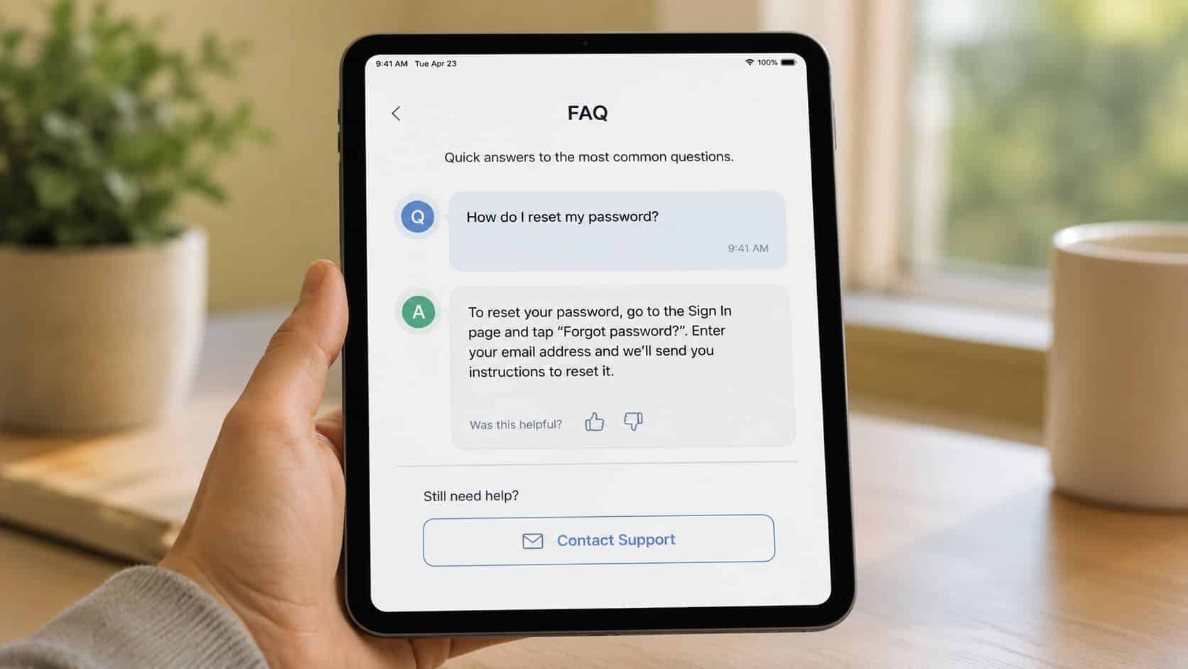 Mini iPad Deals: A UK Buyer's Guide for 2026 4 A person holding a tablet displaying a frequently asked questions screen about resetting a user password.